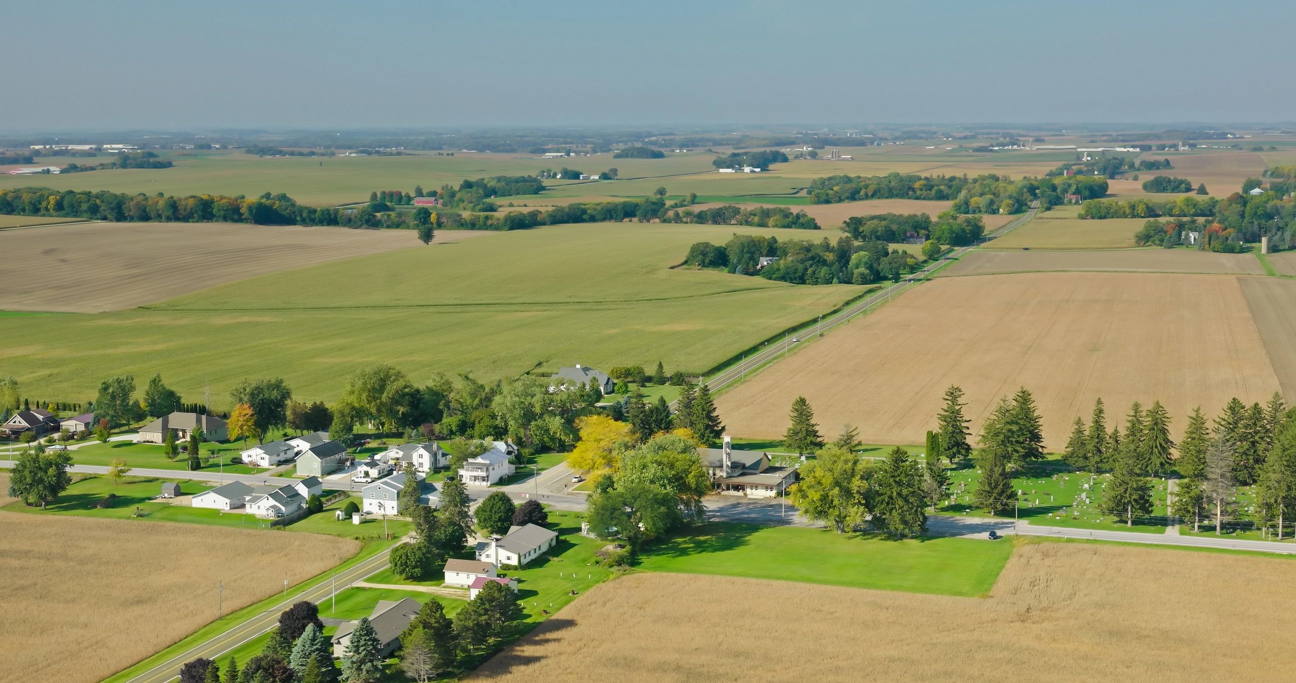 Small Wisconsin community surrounded by fields in autumn